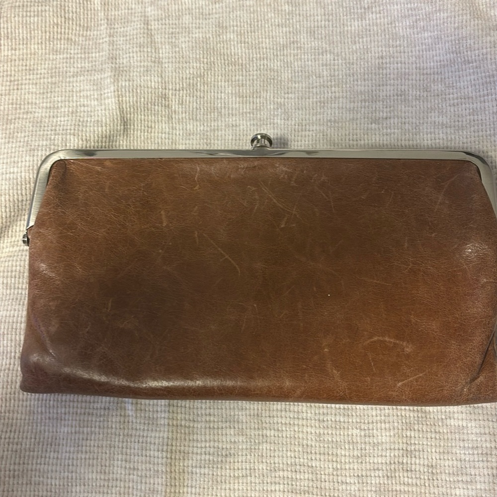 Hobo wallet. Has dust bag. Has a little bit of wear (in pics)